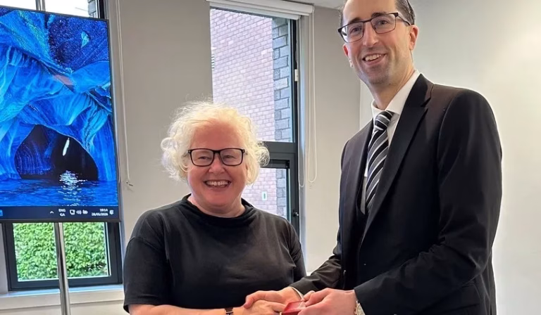 Dr. Adnan Velic receiving his award